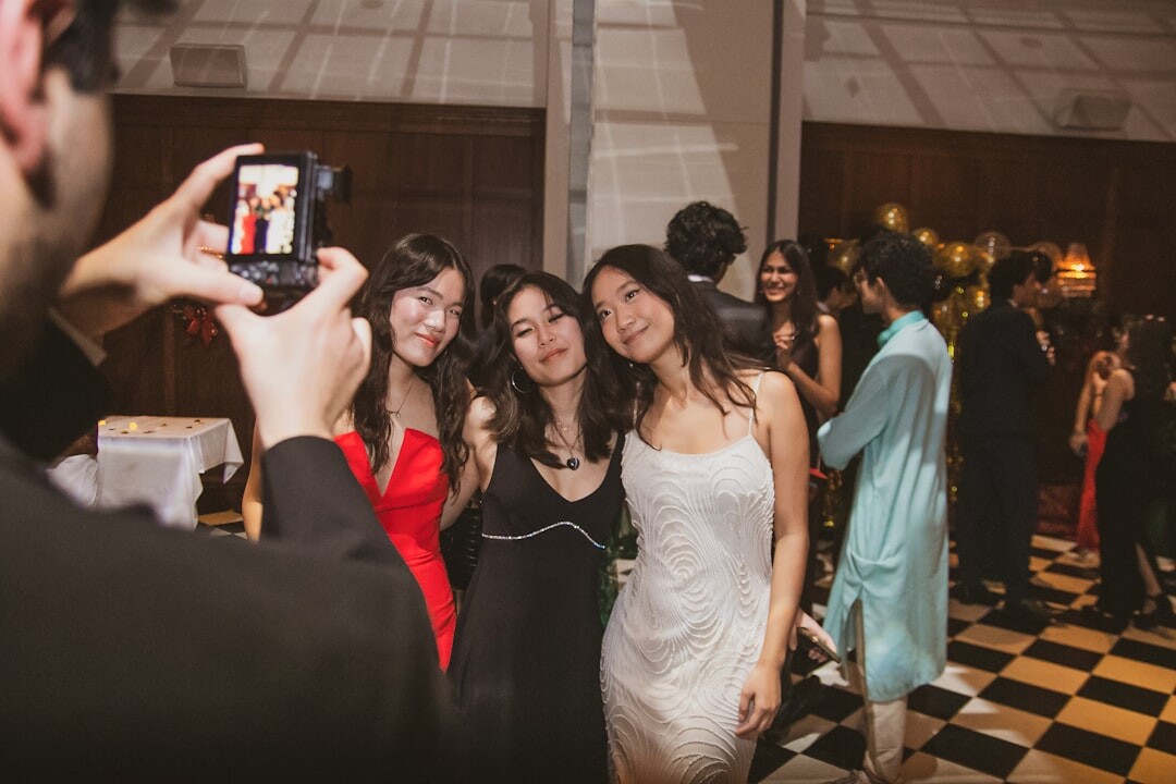 Red carpet gala event with photographers and elegantly dressed guests