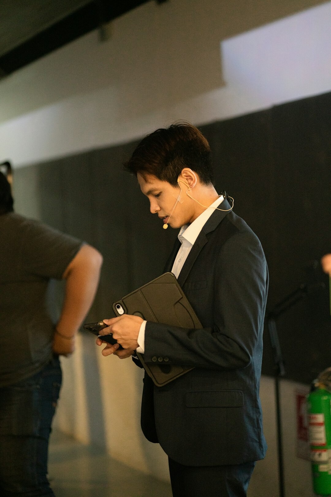 Argentine actor backstage adjusting his tuxedo before an award ceremony