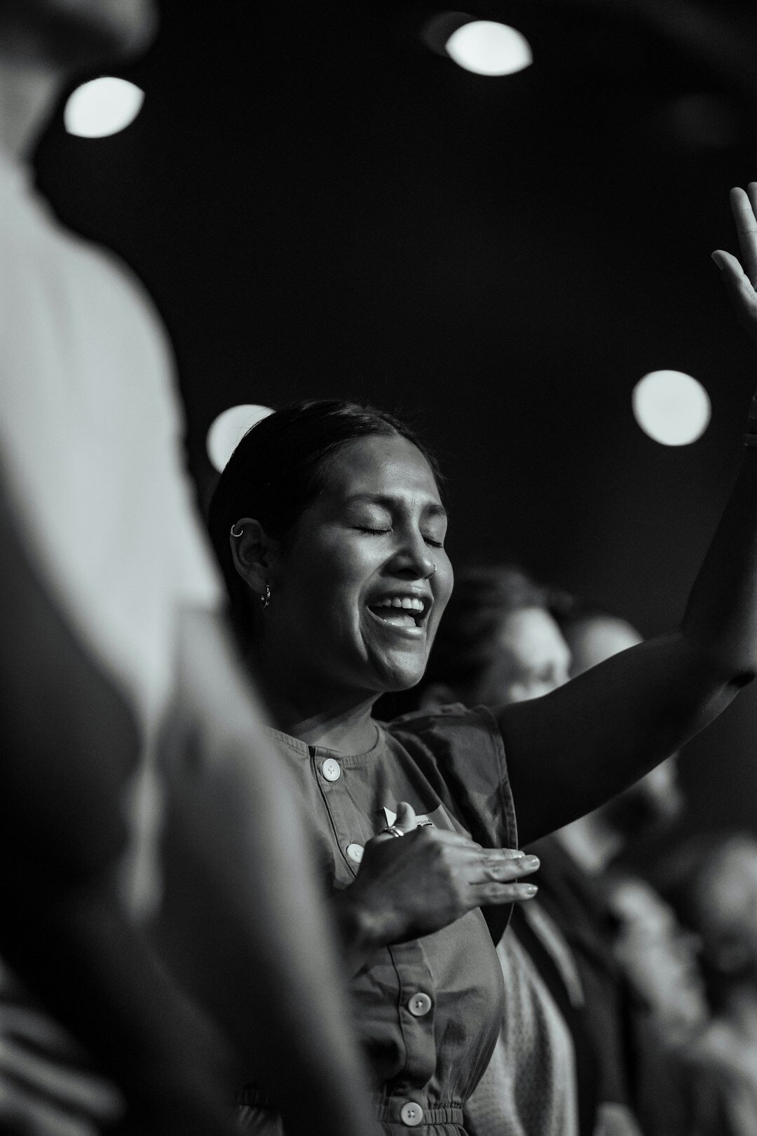 woman singing on stage